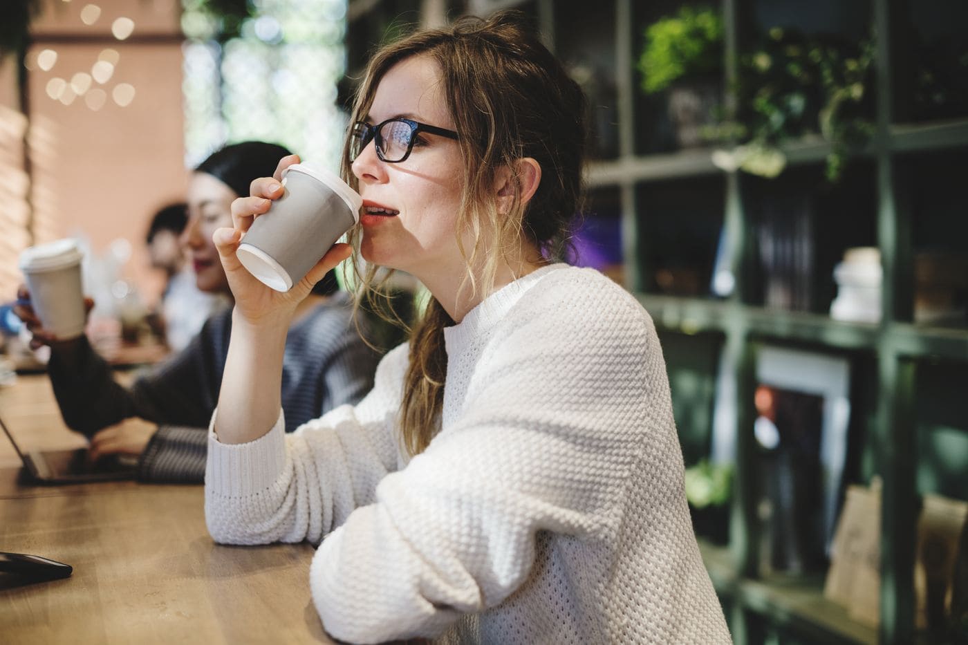 Blond woman having a cup of coffee